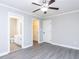 Bright and airy bedroom features a ceiling fan and access to a full bathroom at 211 Milky Way Dr, Apex, NC 27502