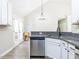 Bright eat-in kitchen featuring stainless steel dishwasher, sink and granite countertops at 211 Milky Way Dr, Apex, NC 27502