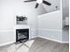 Spacious living room with fireplace, light gray walls, wood floors, and an open concept to kitchen and dining at 211 Milky Way Dr, Apex, NC 27502