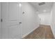 Clean, white entryway with wood-look flooring, leading to the rest of the home at 230 Bay Laurel Dr, Sanford, NC 27330