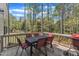 Back deck includes a seating area, grill and views of the wooded property at 2432 Spindle Ct, Raleigh, NC 27603