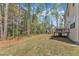 Spacious backyard with lush tree line is perfect for entertaining or relaxing at 2432 Spindle Ct, Raleigh, NC 27603