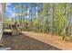 Spacious backyard with lush tree line is perfect for entertaining or relaxing at 2432 Spindle Ct, Raleigh, NC 27603