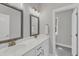 Bathroom featuring double sinks, granite countertops, and modern fixtures at 2432 Spindle Ct, Raleigh, NC 27603