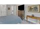 Cozy bedroom features soft carpeting, a dresser with a TV, and a serene atmosphere perfect for relaxation at 2432 Spindle Ct, Raleigh, NC 27603