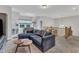 Open bonus room features a cozy couch, foosball table and bright natural light at 2432 Spindle Ct, Raleigh, NC 27603