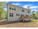 The rear exterior features a backyard deck and abundant windows at 2432 Spindle Ct, Raleigh, NC 27603