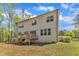 The rear exterior features a backyard deck and abundant windows at 2432 Spindle Ct, Raleigh, NC 27603