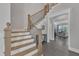 Spacious foyer featuring an elegant staircase and a view into the living room at 2432 Spindle Ct, Raleigh, NC 27603