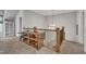 Hallway with a wooden railing and unique decorative furniture at 2432 Spindle Ct, Raleigh, NC 27603