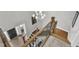 Hallway overlooking the foyer with wooden stairs and a decorative chandelier at 2432 Spindle Ct, Raleigh, NC 27603