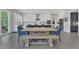 Open kitchen with dining table and ample seating, custom cabinets and stainless steel appliances at 2432 Spindle Ct, Raleigh, NC 27603