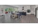 Bright kitchen with stainless steel appliances, an island with seating, and sliding doors to the deck at 2432 Spindle Ct, Raleigh, NC 27603