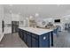 Kitchen island with seating and modern appliances, great for entertaining, and open concept layout at 2432 Spindle Ct, Raleigh, NC 27603
