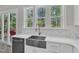 Kitchen sink with stainless steel faucet and view to the deck and backyard with lots of light at 2432 Spindle Ct, Raleigh, NC 27603