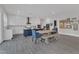 Large kitchen with seating area, modern appliances, an island with seating, and custom cabinets at 2432 Spindle Ct, Raleigh, NC 27603