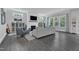Spacious living room with ample natural light, modern fireplace, and comfortable seating at 2432 Spindle Ct, Raleigh, NC 27603