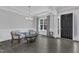 Cozy living room with modern gray walls, white trim, and wood flooring, featuring stylish seating at 2432 Spindle Ct, Raleigh, NC 27603