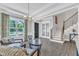 Inviting living room featuring stylish furniture, hardwood floors, and natural light from large windows at 2432 Spindle Ct, Raleigh, NC 27603