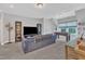 Large living area with a TV, couch, and foosball table for entertaining at 2432 Spindle Ct, Raleigh, NC 27603
