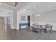 Open-concept living room with views of the staircase and a blue console table, showcasing the hardwood floors at 2432 Spindle Ct, Raleigh, NC 27603
