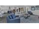 Open-concept living room flowing into the kitchen and featuring comfortable seating and stylish decor at 2432 Spindle Ct, Raleigh, NC 27603