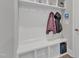 Mudroom includes built-in bench with storage, coat hooks, and shelving, offering functionality and organization at 2432 Spindle Ct, Raleigh, NC 27603