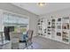 Bright home office space with built-in white shelving and a large window at 2432 Spindle Ct, Raleigh, NC 27603