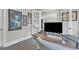 Well-lit office with modern computer, and french doors leading to another room at 2432 Spindle Ct, Raleigh, NC 27603