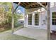 Walk-out basement patio shows french doors leading to back yard and stream at 2604 Wyntercrest Ln, Durham, NC 27713
