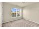 Bright bedroom featuring a window and neutral carpeting at 2604 Wyntercrest Ln, Durham, NC 27713