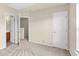 Bedroom with entry to en-suite bathroom, closet, and neutral carpet at 2604 Wyntercrest Ln, Durham, NC 27713
