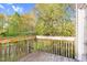 View from the deck showing a private wooded area behind the property at 2604 Wyntercrest Ln, Durham, NC 27713