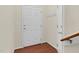 Inviting entryway with a coat rack and beautiful wood-look flooring at 2604 Wyntercrest Ln, Durham, NC 27713