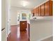 Stylish kitchen featuring warm wood cabinetry and hardwood flooring at 2604 Wyntercrest Ln, Durham, NC 27713