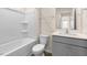 Clean bathroom with white tub and gray vanity at 270 Palm Dr, Sanford, NC 27330