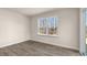 Bright bedroom with large window and vinyl floors at 270 Palm Dr, Sanford, NC 27330
