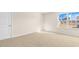 Bright, spacious bedroom with neutral carpet, large window, and natural light at 270 Palm Dr, Sanford, NC 27330