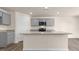 Spacious kitchen featuring a center island with granite countertops and ample storage at 270 Palm Dr, Sanford, NC 27330