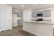 Open concept kitchen with gray cabinets, granite countertops, and stainless steel appliances at 270 Palm Dr, Sanford, NC 27330