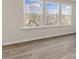 Bright living room features three windows overlooking nature at 270 Palm Dr, Sanford, NC 27330