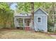 Charming home featuring light blue siding, front porch, and mature trees at 2814 Sarah Ave, Durham, NC 27707
