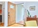Foyer featuring a wood front door, hardwood floors, and an accent table with decor at 2814 Sarah Ave, Durham, NC 27707