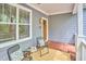Comfortable front porch featuring chairs, a rug, and an exterior light at 2814 Sarah Ave, Durham, NC 27707