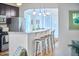 Kitchen featuring stainless steel appliances, marble countertops, and barstool seating at 2814 Sarah Ave, Durham, NC 27707