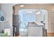 Modern kitchen featuring stainless steel appliances, a marble countertop bar, and an open layout at 2814 Sarah Ave, Durham, NC 27707