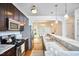 Kitchen with stainless steel appliances and marble countertops connected to an open-concept dining area at 2814 Sarah Ave, Durham, NC 27707