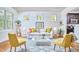 Bright living room featuring ample natural light, hardwood floors, and stylish decor at 2814 Sarah Ave, Durham, NC 27707