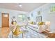 Inviting living room featuring a modern sofa, hardwood floors, and ample light at 2814 Sarah Ave, Durham, NC 27707