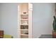 Built-in shelving unit filled with books and decorative items, adding charm to the interior space at 2814 Sarah Ave, Durham, NC 27707